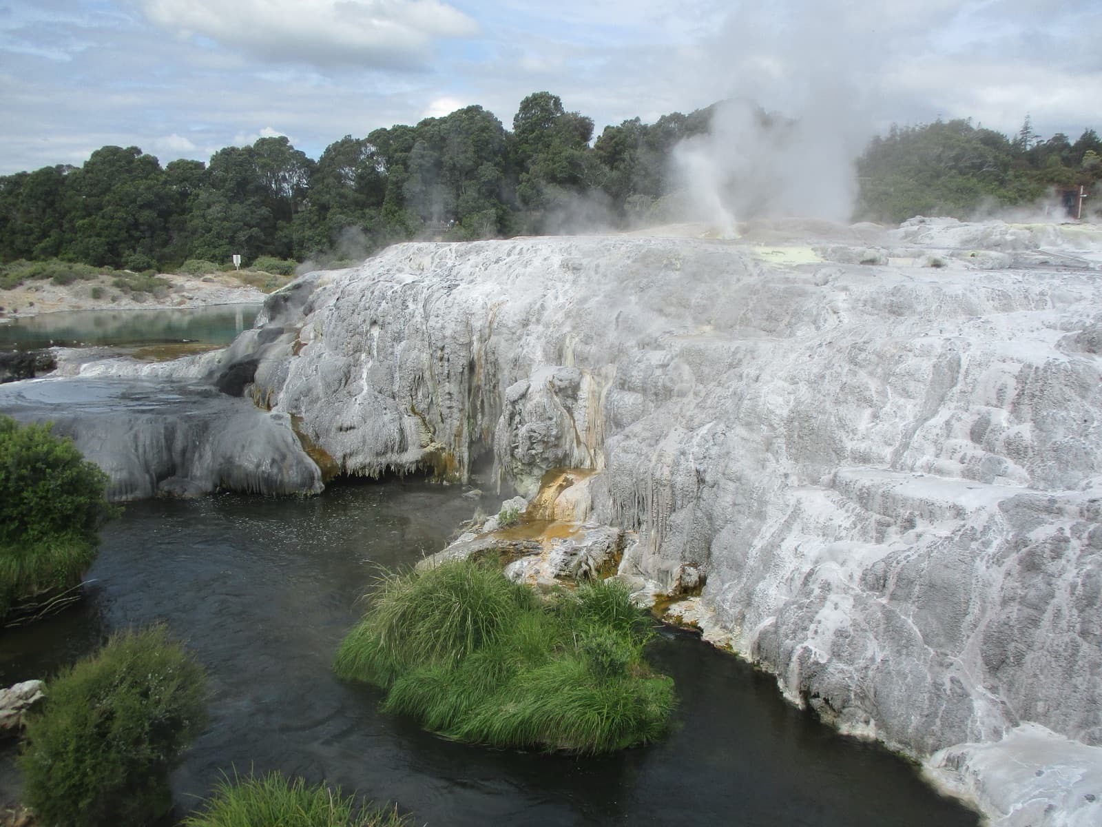 Steaming geothermal pools and silica terraces in Rotorua, New Zealand