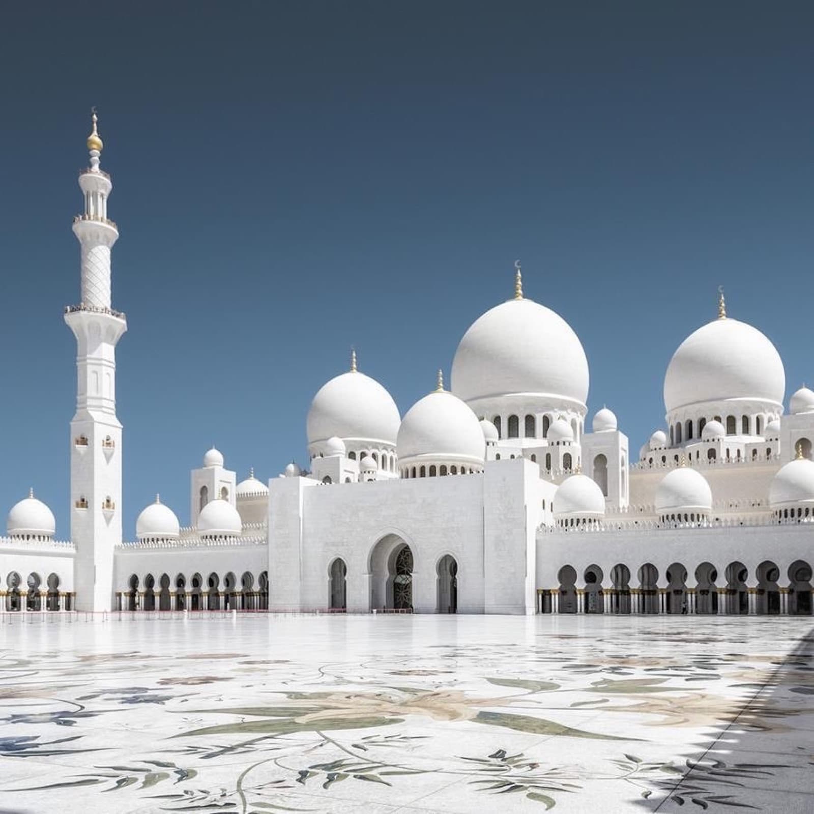 The white domes and arches of Sheikh Zayed Grand Mosque in Abu Dhabi